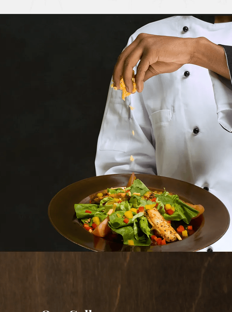 Chef finishing a plated salad.